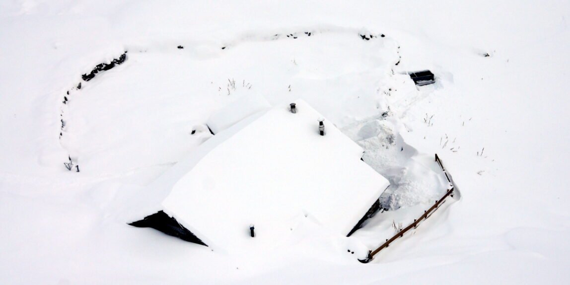 house part buried in the snow